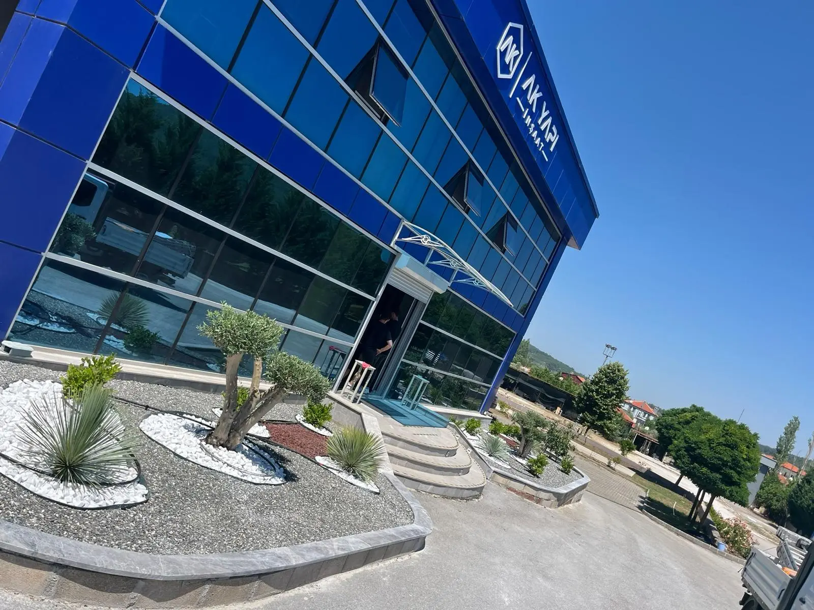 Commercial frontage with gravel beds and planting